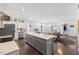 Modern kitchen with gray island and white cabinets at 504 Branch St, Raleigh, NC 27601