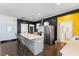 Modern kitchen with island seating and stainless steel appliances at 504 Branch St, Raleigh, NC 27601