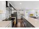 Modern kitchen with stainless steel appliances and white shaker cabinets at 504 Branch St, Raleigh, NC 27601