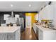 Modern kitchen with island, stainless steel appliances, and hardwood floors at 504 Branch St, Raleigh, NC 27601