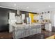 Modern kitchen with white cabinets, quartz countertops, and stainless steel appliances at 504 Branch St, Raleigh, NC 27601