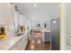 Open concept kitchen with island, stainless steel appliances, and hardwood floors at 504 Branch St, Raleigh, NC 27601