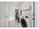 Bright laundry room, featuring washer, dryer, and ample cabinet space at 504 Branch St, Raleigh, NC 27601