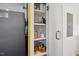 Well-organized pantry with glass-front cabinets and wooden fruit bowl at 504 Branch St, Raleigh, NC 27601
