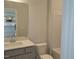 Bathroom with modern vanity, and a shower-tub combo at 53 Priming Way, Angier, NC 27501