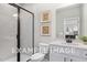 Clean bathroom with white vanity and a frameless shower at 53 Priming Way, Angier, NC 27501