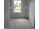 Bedroom featuring a window with views, ready for flooring and paint to create a cozy retreat at 53 Priming Way, Angier, NC 27501