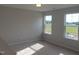 Bright bedroom with large windows overlooking a serene landscape at 53 Priming Way, Angier, NC 27501