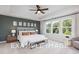 Main bedroom with a king-size bed and a ceiling fan at 53 Priming Way, Angier, NC 27501