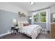 Cozy bedroom with light-colored walls and a double bed at 53 Priming Way, Angier, NC 27501