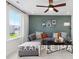 Bonus room featuring a comfortable sectional sofa and accent pillows at 53 Priming Way, Angier, NC 27501