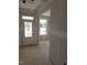 A bright entryway features a white door, a window, and unfinished walls ready to be transformed at 53 Priming Way, Angier, NC 27501