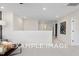Spacious hallway with access to bedrooms and large artwork at 53 Priming Way, Angier, NC 27501