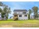 Two-story house with backyard, deck, and siding at 53 Priming Way, Angier, NC 27501