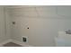 The laundry room includes a white utility sink, wall-mounted shelving, and utility connections at 53 Priming Way, Angier, NC 27501
