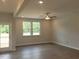 Bright living room features new hardwood floors and a door that lead to a deck at 53 Priming Way, Angier, NC 27501