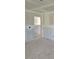 Living room with open doorway, awaiting flooring and finishes to create a comfortable space at 53 Priming Way, Angier, NC 27501