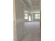Bright open living room with a lot of natural light and unfinished walls and floors at 53 Priming Way, Angier, NC 27501