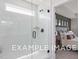 Walk-in shower with glass enclosure and window at 53 Priming Way, Angier, NC 27501