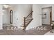 Elegant staircase with dark wood railing and spindles at 53 Priming Way, Angier, NC 27501