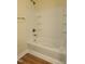 Clean bathroom with a shower/tub combo and tile surround at 5409 Crescentview Pkwy, Raleigh, NC 27606