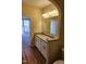 Double vanity bathroom with granite countertops and view of bedroom at 5409 Crescentview Pkwy, Raleigh, NC 27606