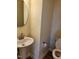 Bathroom with pedestal sink, toilet and flooring at 5409 Crescentview Pkwy, Raleigh, NC 27606