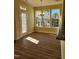Bright dining area with hardwood floors and access to a deck at 5409 Crescentview Pkwy, Raleigh, NC 27606