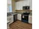 Kitchen with stainless steel appliances and granite countertops at 5409 Crescentview Pkwy, Raleigh, NC 27606