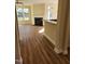 Living room with hardwood floors, fireplace, and access to kitchen at 5409 Crescentview Pkwy, Raleigh, NC 27606