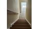 Wooden staircase leading to upper level at 5409 Crescentview Pkwy, Raleigh, NC 27606