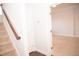 Open carpeted basement area with neutral walls and stairwell at 705 Traditions Grande Blvd, Wake Forest, NC 27587