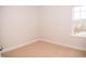 Bright and airy bedroom with neutral carpet and large window at 705 Traditions Grande Blvd, Wake Forest, NC 27587