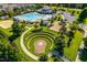 Ample parking and green space surround the pool and playground at 705 Traditions Grande Blvd, Wake Forest, NC 27587