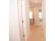Bright hallway with neutral carpet and access to bedrooms at 705 Traditions Grande Blvd, Wake Forest, NC 27587