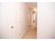 Upstairs hallway with carpet and access to bedrooms at 705 Traditions Grande Blvd, Wake Forest, NC 27587