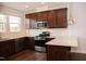 Modern kitchen with granite countertops and stainless steel appliances at 705 Traditions Grande Blvd, Wake Forest, NC 27587