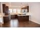 Open concept kitchen with granite countertops and island at 705 Traditions Grande Blvd, Wake Forest, NC 27587