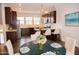 Modern kitchen with breakfast bar and stylish dining area at 705 Traditions Grande Blvd, Wake Forest, NC 27587