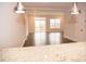 Bright living room with hardwood floors and access to deck at 705 Traditions Grande Blvd, Wake Forest, NC 27587