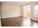 Bright living room with hardwood floors and sliding glass doors leading to a deck at 705 Traditions Grande Blvd, Wake Forest, NC 27587