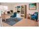 Bright home office with built-in shelving and comfortable seating at 705 Traditions Grande Blvd, Wake Forest, NC 27587