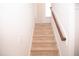 Carpeted staircase with wood railing leading to the upper level at 705 Traditions Grande Blvd, Wake Forest, NC 27587