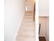 Carpeted staircase with wood railing leading to the second floor at 705 Traditions Grande Blvd, Wake Forest, NC 27587