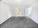 Spacious bedroom with grey carpet and access to bathroom at 83 Valleyfield Dr, Clayton, NC 27527