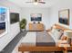 Virtually staged bedroom with large bed, dresser, and window at 83 Valleyfield Dr, Clayton, NC 27527