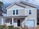Two-story house featuring a neutral color scheme and a two-car garage at 83 Valleyfield Dr, Clayton, NC 27527