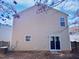 Beige house exterior with sliding glass doors and small windows at 83 Valleyfield Dr, Clayton, NC 27527