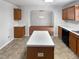 Kitchen with island and view into dining area at 83 Valleyfield Dr, Clayton, NC 27527