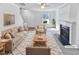 Virtually staged living room with fireplace and neutral decor at 83 Valleyfield Dr, Clayton, NC 27527